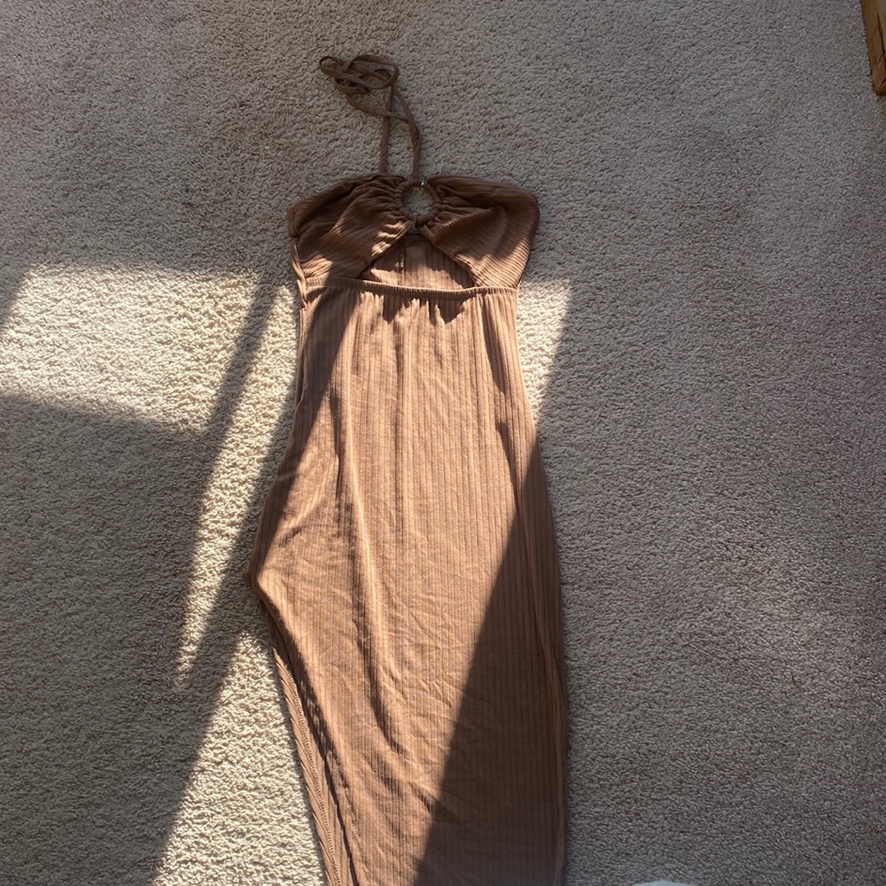 brand new windsor dress, slit on slide and wraps around the neck. Size small